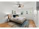 Bright bedroom with a ceiling fan and multiple windows allowing for plenty of natural light at 138 Lakefront Dr, Mooresville, NC 28117
