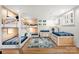 Charming bunk room with built-in bunk beds, complemented by a cozy rug and natural light at 138 Lakefront Dr, Mooresville, NC 28117