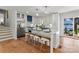 Open kitchen features a center island with bar seating and stainless steel appliances, ideal for entertaining at 138 Lakefront Dr, Mooresville, NC 28117