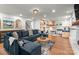 Open-concept living room with a large sectional adjacent to the bunk room at 138 Lakefront Dr, Mooresville, NC 28117