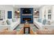 Spacious living room features a modern fireplace, stylish décor, and bright light at 138 Lakefront Dr, Mooresville, NC 28117