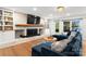 Cozy living room with a stunning white brick fireplace and flatscreen tv at 138 Lakefront Dr, Mooresville, NC 28117