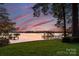 Picturesque waterfront view with dock, showcasing serene lake living at its finest at 138 Lakefront Dr, Mooresville, NC 28117