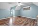 This large room has beautiful floors and light blue walls, making it a calming and inviting space to unwind at 139 Pleasant Garden Dr, Taylorsville, NC 28681