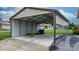 Large carport providing ample covered parking and storage space at 139 Pleasant Garden Dr, Taylorsville, NC 28681