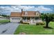 Inviting home with a well-maintained lawn and classic curb appeal at 139 Pleasant Garden Dr, Taylorsville, NC 28681