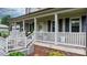 Close-up of the charming front porch, showcasing the welcoming entrance and decorative elements at 139 Pleasant Garden Dr, Taylorsville, NC 28681