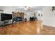 Inviting living room showcasing hardwood floors, a stone fireplace, and bright natural light at 139 Pleasant Garden Dr, Taylorsville, NC 28681