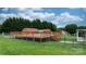 Pool area featuring a wooden deck and fenced perimeter, perfect for summertime enjoyment and privacy at 139 Pleasant Garden Dr, Taylorsville, NC 28681