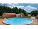 Above-ground pool with surrounding deck, ideal for summer relaxation and entertainment at 139 Pleasant Garden Dr, Taylorsville, NC 28681
