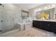 Luxurious bathroom with a separate glass shower, soaking tub, and double vanity sinks at 1431 Hubert Graham Way, Tega Cay, SC 29708