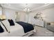 Spacious bedroom features a tray ceiling, lots of natural light, and modern decor at 1431 Hubert Graham Way, Tega Cay, SC 29708