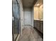 Bathroom with gray tile, walk-in shower and double sinks at 147 Dubois Dr, Mooresville, NC 28115