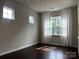 Bright bedroom with large windows and decorative curtains at 147 Dubois Dr, Mooresville, NC 28115