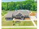 Aerial view of a stunning clubhouse with a beautiful swimming pool, lush landscaping, and ample parking at 147 Dubois Dr, Mooresville, NC 28115