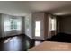 Corner living room with natural light and white decorative curtains at 147 Dubois Dr, Mooresville, NC 28115