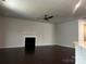 Spacious living room with fireplace and ceiling fan, perfect for entertaining at 147 Dubois Dr, Mooresville, NC 28115