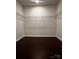 Spacious walk-in closet with ample shelving and dark hardwood floors offers plenty of storage space at 147 Dubois Dr, Mooresville, NC 28115