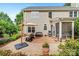 Beautifully landscaped backyard with patio and seating area, plus a screened-in porch at 16018 Hollingbourne Rd, Huntersville, NC 28078