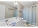 This bathroom offers double sinks with a toilet, towel rack, and bath tub at 16018 Hollingbourne Rd, Huntersville, NC 28078