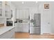 Bright kitchen with white cabinetry and stainless steel appliances at 16018 Hollingbourne Rd, Huntersville, NC 28078