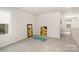 Versatile bonus room features neutral carpet, natural light, and flexible space at 16018 River Tree Ln, Charlotte, NC 28278