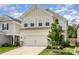 Charming two-story home with neutral siding, manicured lawn, and inviting curb appeal under blue skies at 16018 River Tree Ln, Charlotte, NC 28278