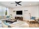 Cozy living room with a large TV, comfortable seating, hardwood floors, and an inviting atmosphere for relaxation at 16018 River Tree Ln, Charlotte, NC 28278
