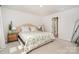 Inviting main bedroom features neutral carpet, natural light, and a decorative accent mirror at 16018 River Tree Ln, Charlotte, NC 28278