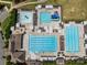 Aerial view of a community pool area with a variety of pools, slides, and lounge seating at 16028 Cranleigh Dr, Huntersville, NC 28078