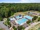 A beautiful community pool area featuring multiple pools, waterslides, and lounge seating at 16028 Cranleigh Dr, Huntersville, NC 28078