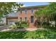 Charming brick two-story home featuring a well-manicured lawn and inviting front entrance at 16028 Cranleigh Dr, Huntersville, NC 28078