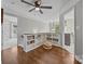 Bright hallway with wood floors, built-in shelving, and access to a bedroom at 16028 Cranleigh Dr, Huntersville, NC 28078