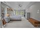 Spacious main bedroom with tray ceilings, lots of natural light, and ample space for a desk at 16028 Cranleigh Dr, Huntersville, NC 28078
