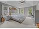Spacious main bedroom with tray ceilings, lots of natural light, and ample space for a desk at 16028 Cranleigh Dr, Huntersville, NC 28078