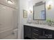 Updated bathroom features marble vanity, subway tile and shower at 16308 Woolwine Rd, Charlotte, NC 28278