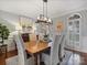 Elegant dining area with stylish chandelier, neutral decor, and lots of natural light at 16308 Woolwine Rd, Charlotte, NC 28278