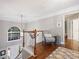 Bright foyer featuring hardwood floors, staircase, pendant lighting and chair at 16308 Woolwine Rd, Charlotte, NC 28278