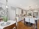 Beautiful kitchen with breakfast nook, white cabinets, and an island with seating at 16308 Woolwine Rd, Charlotte, NC 28278