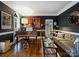 Cozy sitting room with dark walls, hardwood floors, and beautiful decor at 16308 Woolwine Rd, Charlotte, NC 28278