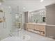 Spa-like main bathroom with double vanity, glass shower, and soaking tub at 16308 Woolwine Rd, Charlotte, NC 28278