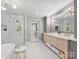 Bright main bathroom features double vanity, glass shower, and soaking tub at 16308 Woolwine Rd, Charlotte, NC 28278