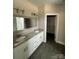 Bright bathroom featuring a double vanity with granite countertop and modern fixtures at 1987 Robert Rufty Ln, Catawba, NC 28609