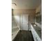 Bathroom showcasing a shower, door to another room, and a vanity with granite countertop at 1987 Robert Rufty Ln, Catawba, NC 28609