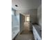 Bright bathroom with white cabinets, double granite vanity, and a step-in shower and open doorway at 1987 Robert Rufty Ln, Catawba, NC 28609