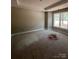 A bedroom offers a large window bringing in natural light to the plywood flooring at 1987 Robert Rufty Ln, Catawba, NC 28609