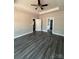 Bedroom features multiple doorways, wood-look flooring, neutral walls, and white trim at 1987 Robert Rufty Ln, Catawba, NC 28609