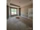 Sunlit bedroom featuring trim and a large window, creating a serene and inviting atmosphere at 1987 Robert Rufty Ln, Catawba, NC 28609
