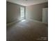 A bedroom offers natural light from the window and a door at 1987 Robert Rufty Ln, Catawba, NC 28609