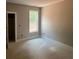 This bedroom has a window and unfinished floors at 1987 Robert Rufty Ln, Catawba, NC 28609
